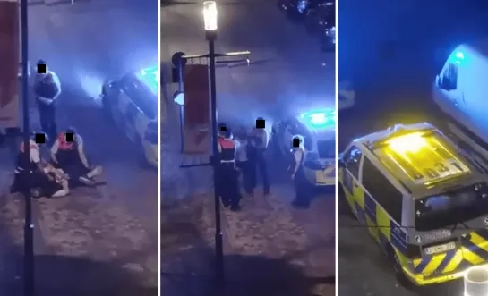 Agent slaat geboeide man in het gezicht